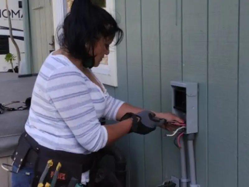 Licensed electrician wiring an exterior subpanel in Nitro
