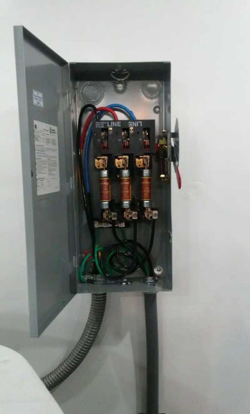 Three-phase disconnect switch installed for Smoke Detector Installation in Nitro