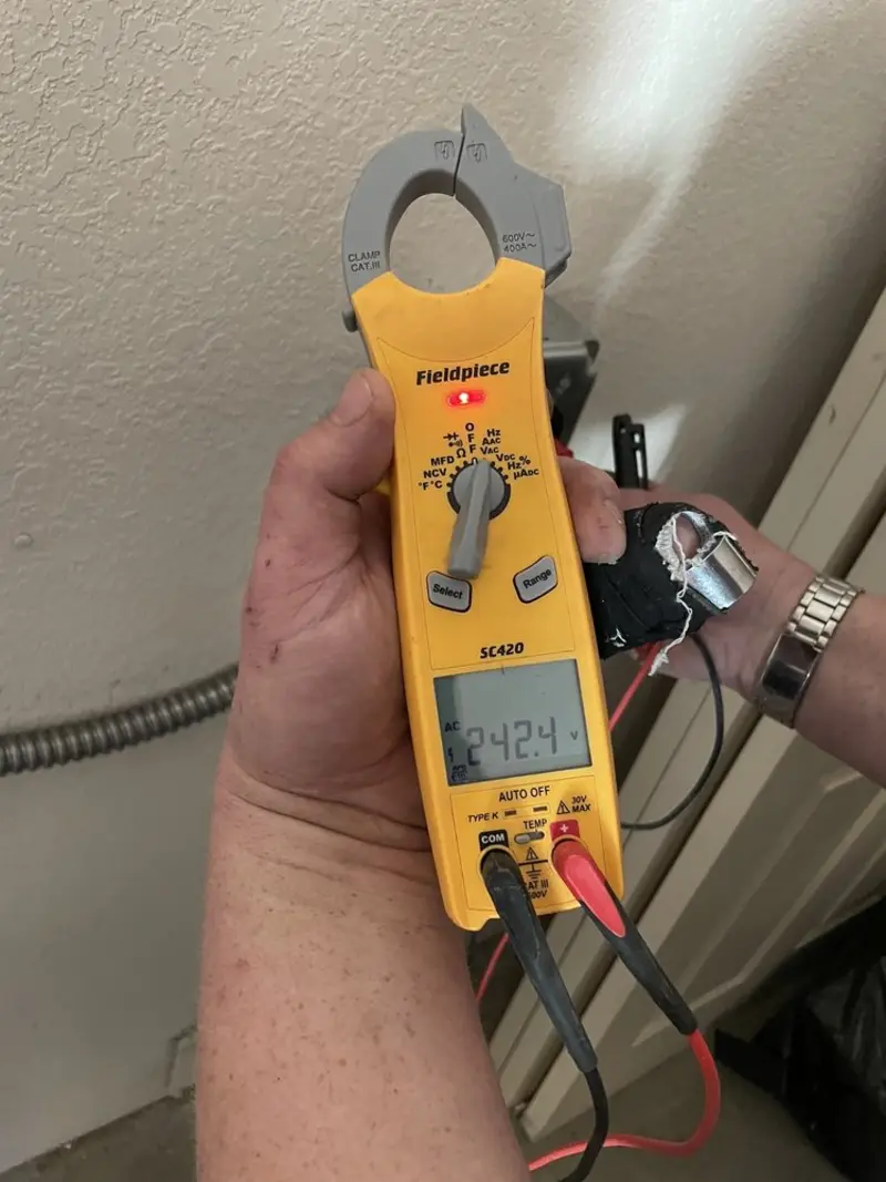 Voltage testing with clamp meter during Recessed Lighting Installation in Nitro